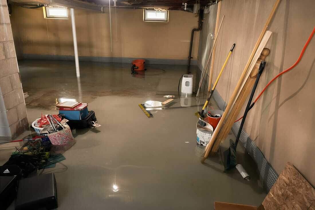 Standing water flooding a Brooklyn basement floor before emergency water removal and extraction